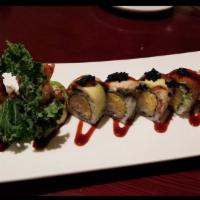 Dinosaur Roll · Shrimp tempura and mango topped with eel, avocado and eel sauce.