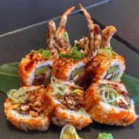Dynamite Spider Roll · Soft shell crab, cucumber , avocado inside topped with fish eggs and eel sauce.