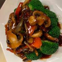 Wild Mushrooms Plate · Shiitake, king oyster, market mushrooms and assorted veggies in a soy garlic wine sauce. Ser...