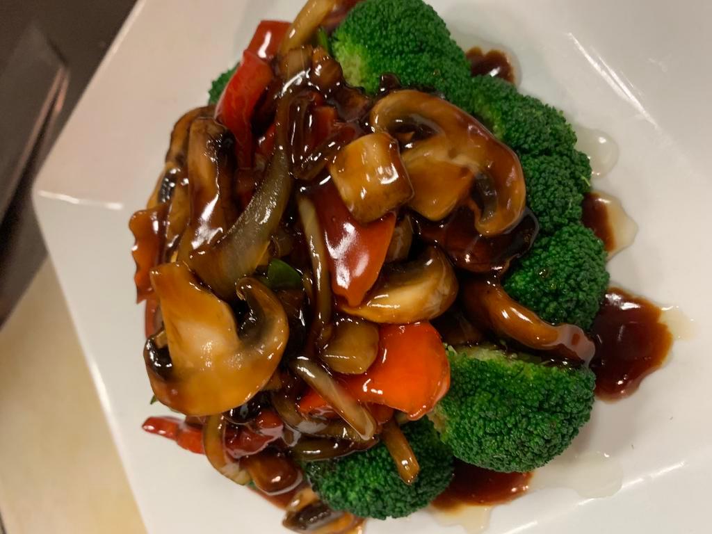 Wild Mushrooms Plate · Shiitake, king oyster, market mushrooms and assorted veggies in a soy garlic wine sauce. Served with white or brown rice or fried rice.