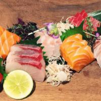 Daily Catch Sashimi · 16 pieces of special sashimi with sushi rice. Your choice of miso soup or house salad.