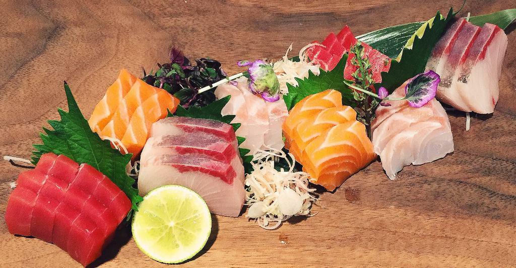 Daily Catch Sashimi · 16 pieces of special sashimi with sushi rice. Your choice of miso soup or house salad.