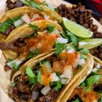 Meat Taco · 1 piece. A small corn tortilla folded and filled with your choice of meat topped with onions...