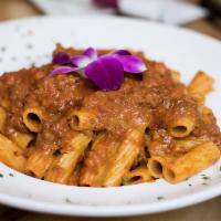 Rigatoni Bolognese · In a hearty meat sauce.
