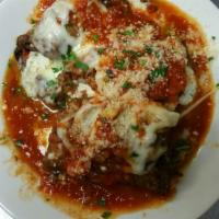Eggplant Rollatini · Eggplant stuffed with ricotta, covered with sauce and melted mozzarella cheese. Served with ...