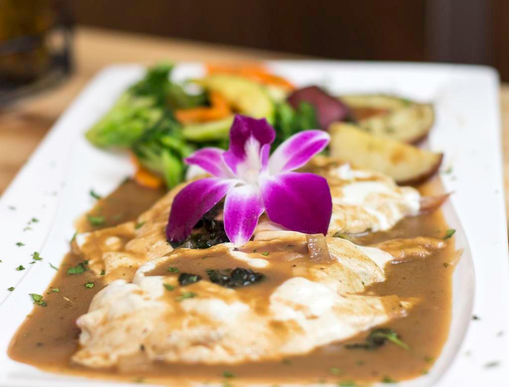 Veal Sorrentino · Topped with eggplant, mozzarella cheese and prosciutto in a demi glaze. Served with side salad, your choice of pasta or roasted potatoes and vegetables.