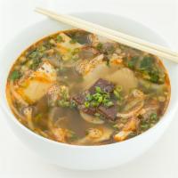 Spicy Bún Bò Huế · Beef shank, thin pork shank, Vietnamese ham, and pork blood cubes in a spicy lemongrass infu...