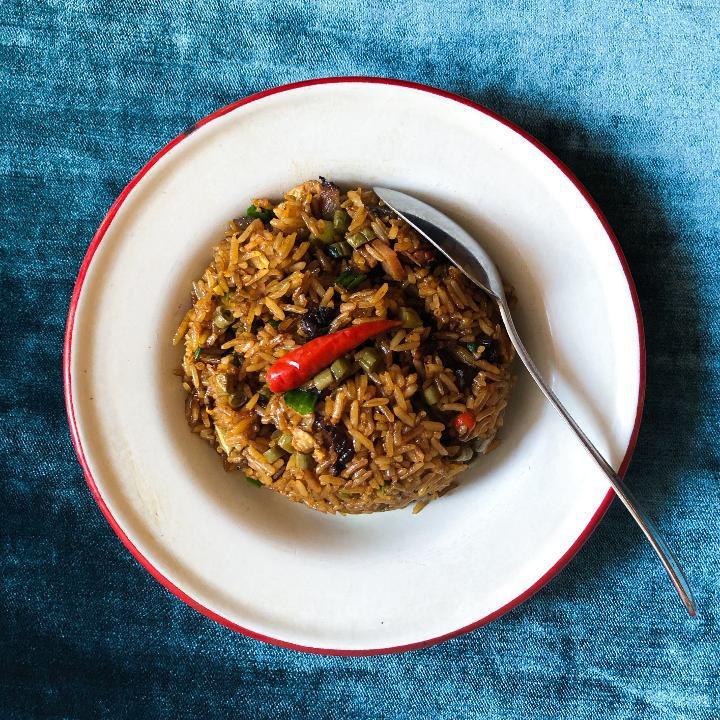 Xiangxi Fried Rice · A spicy fried rice with Chinese bacon (can be made without), egg, pickled string beans, birds eye pepper. Egg free and Vegetarian option available please select modification.