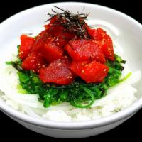 Toshiko Poke Bowl · Sushi rice, ocean salad, tuna mixed with our spicy house-made poke sauce, topped with green ...