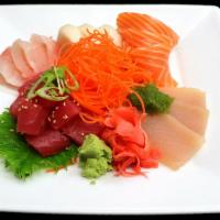 Chef's Choice Sashimi · Fourteen pieces of chef's choice sashimi on top of the ice, garnished with carrots, ginger, ...