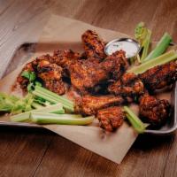 Smoked & Grilled Wings · Better for you wings cooked low and slow over hickory wood.