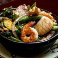 2. Combination in Clay Pot · Com tay cam thap cam. Stir-fried onion, garlic, chicken, pork, shrimp, squid, and mix vegeta...
