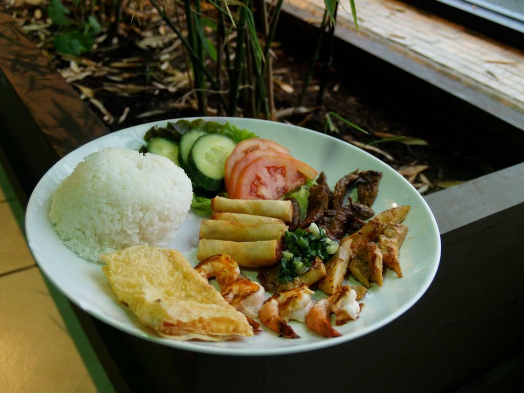 6. Combo Rice Plate  · Com dia dac biet. Broken rice with chicken, beef, shrimp, imperial rolls, and shrimp cake.