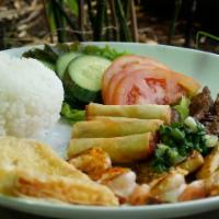 36. Rice Plate  · Cơm dia. Vermicelli noodle bowl comes with lettuce, mint leaves, cucumber, bean sprouts, and...