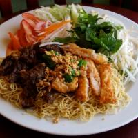 38. Egg Noodles  · Mi. Egg noodle bowl comes with lettuce, mint leaves, cucumber, bean sprouts, and pickled car...