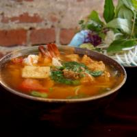 45. Vermicelli Soup   · Bun rieu. Served With shrimp, pasted shrimp, pasted crab, and tomato. Topped with green onio...