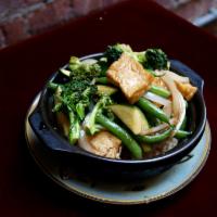 50. Tofu in Clay Pot  · Cơm tay cam chay. Stir-fried with onion, garlic, mixed vegetables, and tofu. Served with bak...