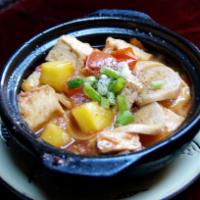 55. Tofu Stew in Clay Pot  · Tau hu kho to. Stew in clay pot with garlic, tofu, mushroom, tomato, and pineapple. Topped w...