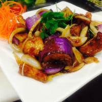 77. Stir-Fried Eggplants  · Ca tím xao. Stir-fried with onions, garlic, lemon grass, basil, and house sauce.