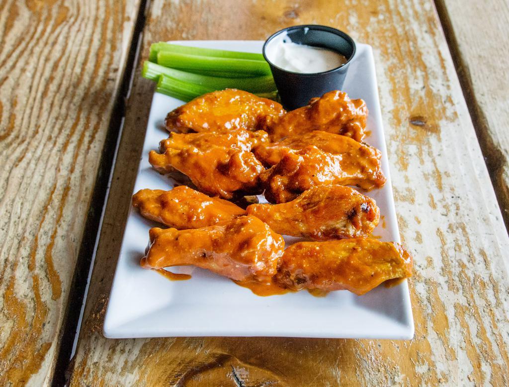 Crispy Wings · Tossed in choice of sauce.
