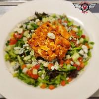 Buffalo Chicken Salad · Your choice of grilled or fried chicken strips tossed in Buffalo sauce. Crisp lettuce, fresh...