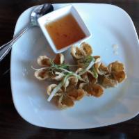 Fried Stuffed Wonton · Served with Dungeness crab and cream cheese.