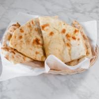 Naan · Leavened white flour bread. Freshly baked in our clay oven. 