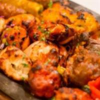 Tandoori Platter · Sampler of chicken tikka, malai kabab, lamb, kabab, reshmi kabab and herbed tandoori shrimp,...