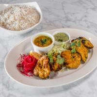 Chicken Tikka · Boneless pieces of tender chicken subtly flavored with our house spices and herbs; roasted o...