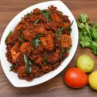 Chicken Vepudu · Tender chicken chunks cooked with onions, green chiles, ginger, garlic and curry leaves in a...