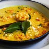 Cochin Shrimp Curry · Simmered in a spiced coconut sauce, accented with ginger and curry leaves. 