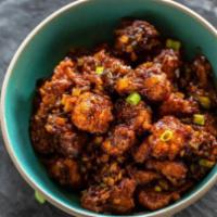Cauliflower Manchurian · Crispy cauliflower florets cooked in a tangy ginger and garlic sauce flavored with star anise.