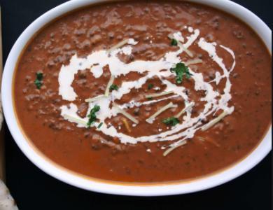 Black Lentils · Seasoned with regional spices and cooked in a mild tomato sauce, enriched with butter. Veggie. 