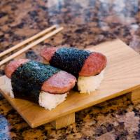 Spam Musubi (2pc.) · 2 Spam Musubi. A block of rice topped with a dash of Teriyaki sauce and a slice of Spam, wra...
