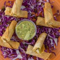 Sedona Taquitos · 4 crisp corn tortillas rolled with seasoned pulled chicken, chile and herbs; served with gre...