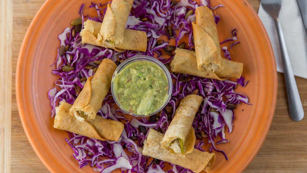 Sedona Taquitos · 4 crisp corn tortillas rolled with seasoned pulled chicken, chile and herbs; served with green chile-pumpkin seed sauce.