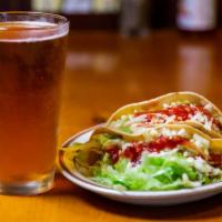 17. Two Tacos Combo · Deep fried crunchy tacos. Choice of ground or shredded beef or shredded chicken. Served with...