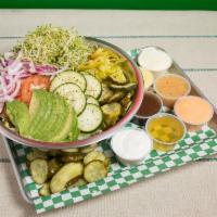 Green Salad · Lettuce, tomatoes, red onion, pickles, peppers, cucumbers and sprouts with your choice of dr...