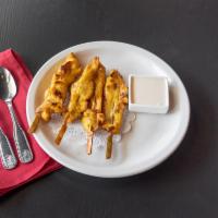 Grilled Chicken Satay · 4 pieces. Tender and marinated chicken grilled on skewer.