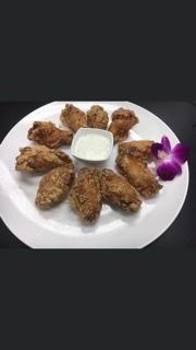 Traditional Wings · 10 pieces. Choice of hand battered fried wings or cooked in Buffalo sauce.