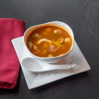 Tom Yam Kung Soup · Lemongrass soup with mushrooms, tomatoes, hint of spicy and sour soup. Hot and spicy.