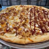 Chicken Bacon Ranch Pizza · Breaded chicken, mozzarella, cheddar cheese, bacon, and finished with cool ranch dressing.