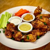 Wings  · 4,8, or 12  House Seasoned lightly floured wings served with dipping sauce, celery and carro...