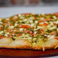 Lil Italy Pizza · Olive oil, garlic, mozzarella, basil, sliced tomatoes, Grana Padano, feta cheese and pesto.