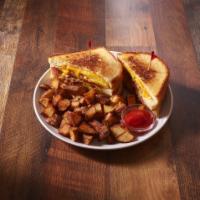 The Garth Breakfast Sandwich · Excellent. A triple decker breakfast sandwich with fluffy scrambled eggs, melted cheddar che...