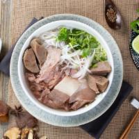 Shebang Beef Pho · A whole shebang of tender brisket, fine rib-eye slices and juicy meat balls. Served in our 1...