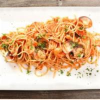 Spaghetti Seafood “ADP” Style · Calamari, squid, salmon, clams, mussels and shrimps.