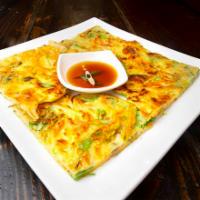 Scallion Pancake · Korean green onion pancake with your choice of kimchi or seafood added in.