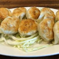 L13a. Pan Fried Chives Pork Dumplings  生煎韭菜肉饺子 (10) · Ten pieces