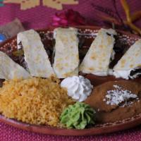 Quesadillas Norteñas · Filled with your choice of stuffing. Served with beans and cream.